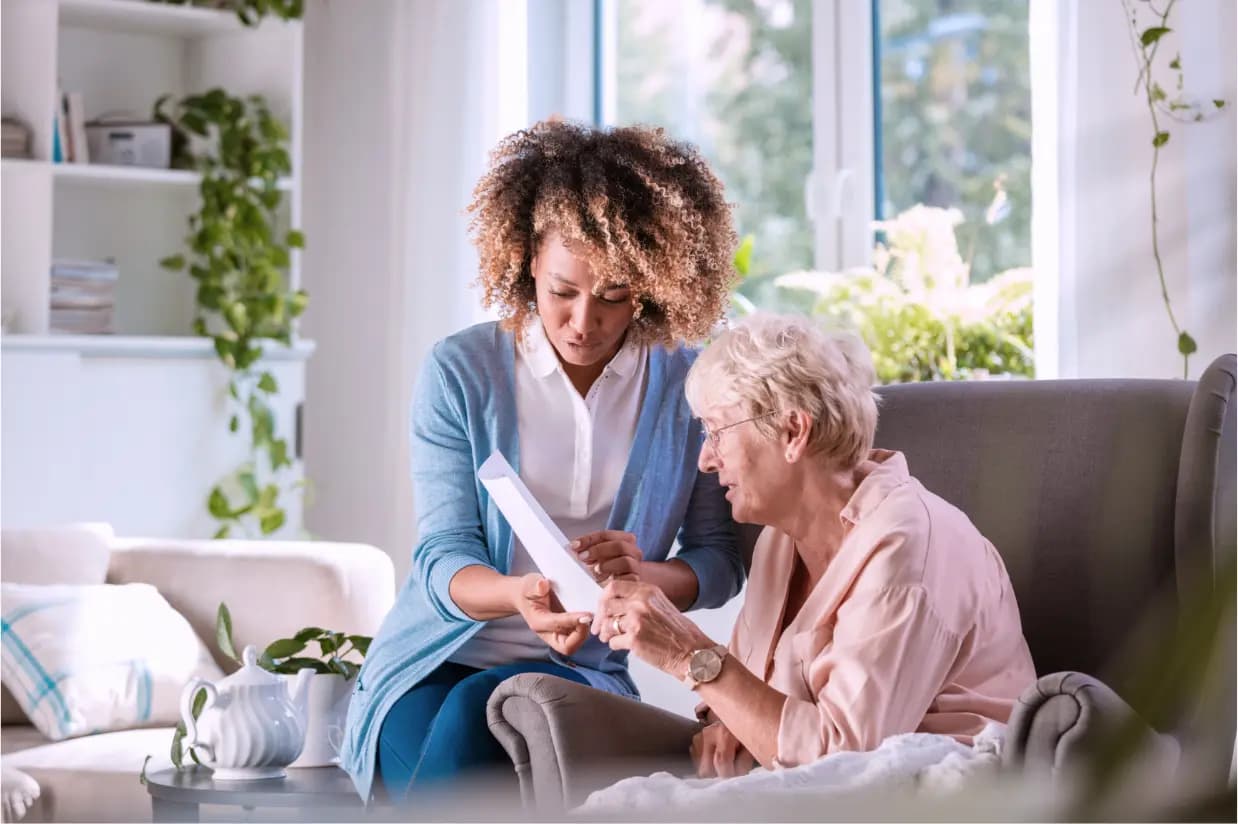 Caregiver helping senior client